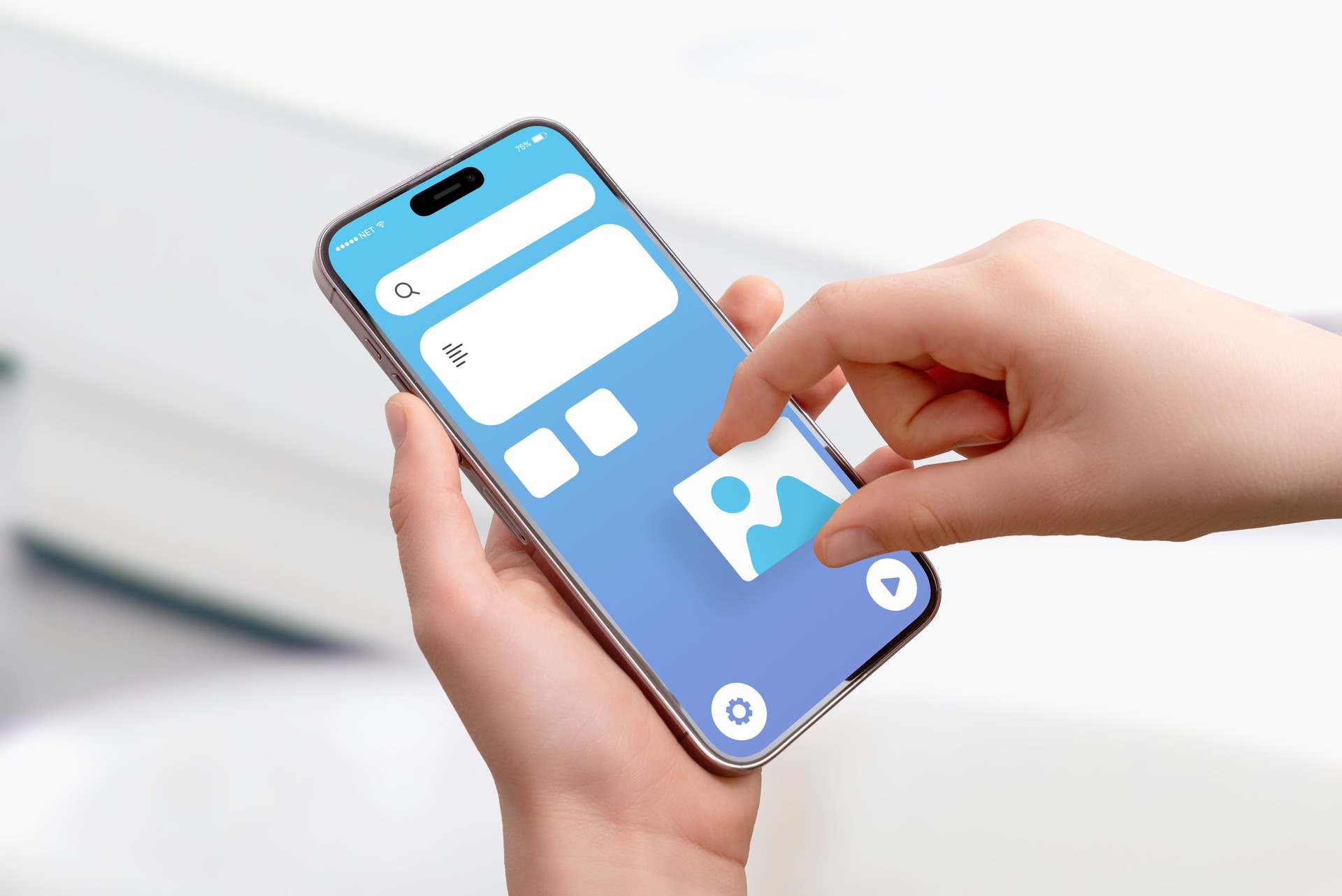 Close-up of hand holding smartphone, placing picture image box on app interface, concept of drag-and-drop UI design and mobile application development